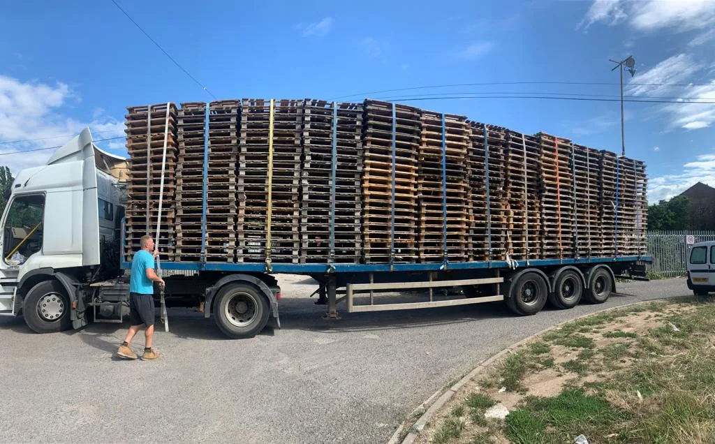 Articulated lorry loaded with pallets ready to leave the yard