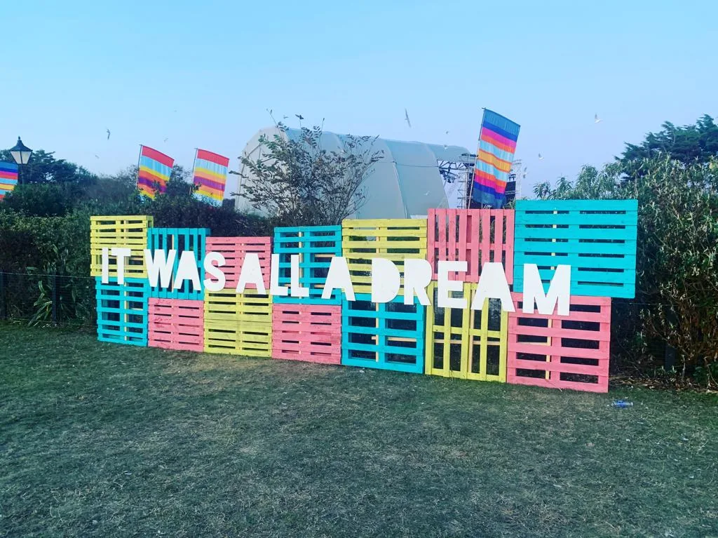 Colourful painted pallets arranged as an outdoor festival installation
