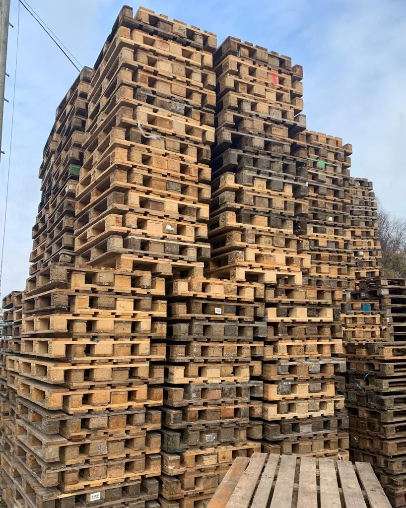 Stacks of wooden pallets sorted and ready for delivery in the Portsmouth yard